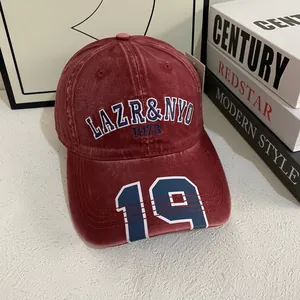 Vintage burgundy washed cotton baseball cap with embroidered letters and 19 digit
