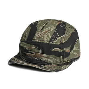 Detail view of tiger stripe camouflage camper cap with durable canvas texture