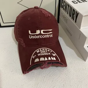 Distressed burgundy baseball cap with white embroidery and broken brim design for women
