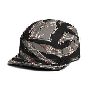 Detail of 5-panel camper hat featuring tiger stripe camo pattern and side eyelets