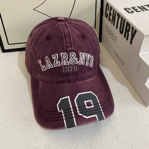 Detailed view of vintage washed canvas baseball cap with LAZR&NYO 1978 embroidery
