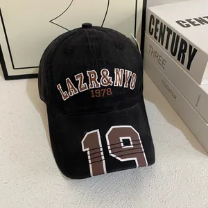Detail shot of vintage black baseball cap featuring 3D LAZR&NYO 1978 embroidery