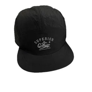 Breathable black five-panel camper hat with college graphics and metallic eyelets