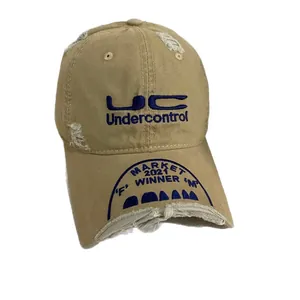 Vintage khaki canvas baseball cap with distressed details and custom blue embroidery