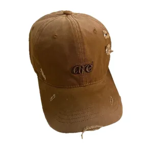 Distressed brown baseball cap with 'are' letter embroidery and vintage torn details