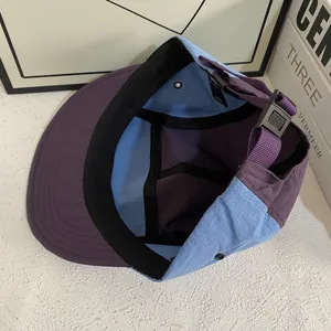 Detail view of quick-dry five-panel cap interior showing sweatband and plastic buckle