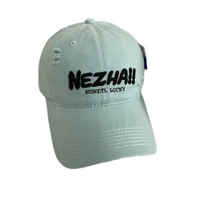 Distressed light blue baseball cap with black NEZHA embroidery on a white background