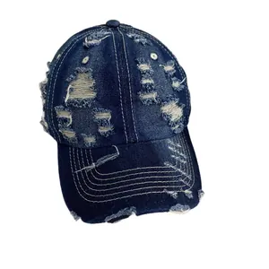 Vintage washed denim distressed baseball cap in navy blue with torn details and wide brim
