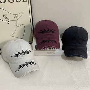 Distressed baseball caps with flame embroidery and frayed edges in multiple colors
