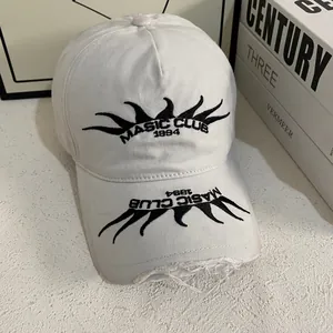 Detailed embroidery of Masic Club 1994 flame pattern and distressed brim on white cap
