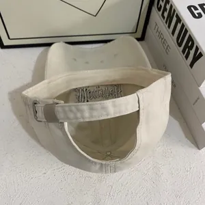 Detail of adjustable metal buckle and gothic embroidery inside the off-white baseball cap