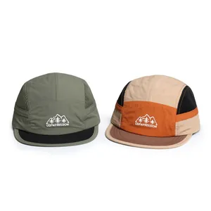 Detail of five-panel outdoor camping caps with breathable mesh and mountain embroidery