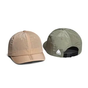 Detail of breathable quick-dry ripstop fabric and adjustable buckle on outdoor caps