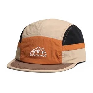Detail of mountain embroidery and mixed color fabric on the five-panel camper hat