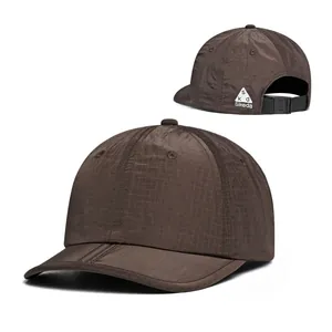Close-up of quick-dry ripstop fabric and adjustable buckle on dark brown baseball cap