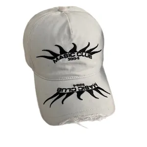 White street style baseball cap with flame embroidery and distressed frayed edges