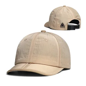 Detail view of khaki quick-dry baseball cap featuring ripstop fabric and adjustable buckle