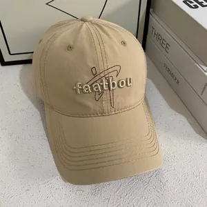 Khaki cotton baseball cap with embroidered letters and curved brim for casual street style