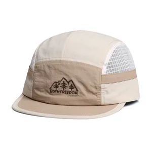 Detailed close-up of quick-dry mesh panels and UDFMFREEDOM embroidery on mountain cap
