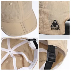 Detail view of khaki quick-dry baseball cap featuring breathable texture and adjustable buckle