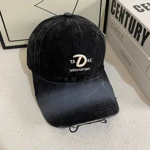 Vintage washed black baseball cap with 3D embroidery on a minimalist white desk