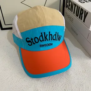 Mesh breathable baseball cap with khaki and blue contrast panels and orange brim detail