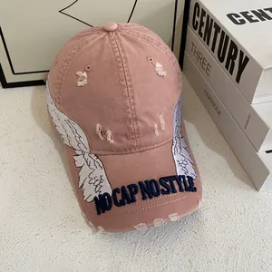 Vintage pink distressed baseball cap with angel wing embroidery and stylish slogan