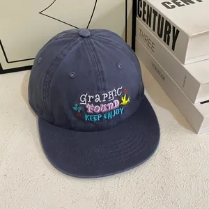 Flat brim navy blue baseball cap with colorful Graphic Found embroidery and floral patterns