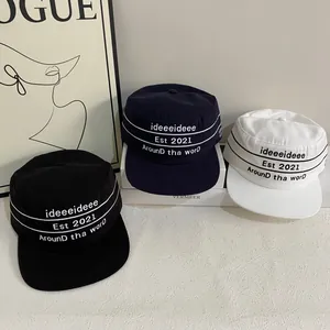 Retro flat top baseball caps in black, navy, and white with street style embroidery