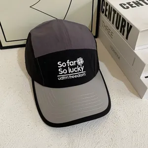 Detail of five-panel quick-dry baseball cap with 3D embroidery and grey color blocking
