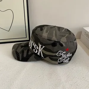 Detail of camouflage military cap featuring RSK embroidery and Fashion Kills text