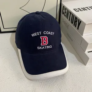 Macro detail of navy cotton baseball cap with vintage B embroidery and contrast piping