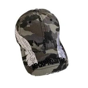 Distressed camo baseball cap with white wing patches and NO CAP NO STYLE embroidery