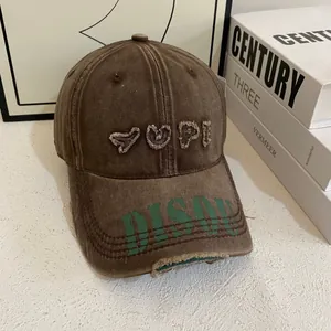 Detailed macro view of distressed vintage baseball cap with embroidery and frayed edges