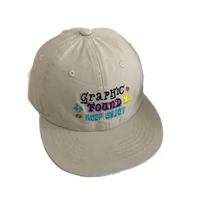 Beige baseball cap with colorful embroidery of letters and floral bird patterns