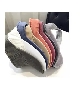 Close-up of sun visors in various colors with washed cotton fabric and stitching details