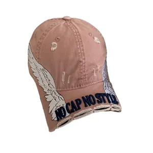 Distressed pink baseball cap with wing embroidery and NO CAP NO STYLE 3D text