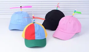 Detailed view of colorful propeller baseball caps in pink, black, blue and multi-color