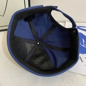 Detail view of cotton docker hat interior featuring 100% cotton label and black sweatband