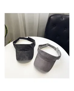 Detail of washed cotton sun visors showing stitching and adjustable straps