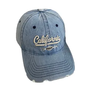 Vintage light blue denim baseball cap with California embroidery and distressed brim details