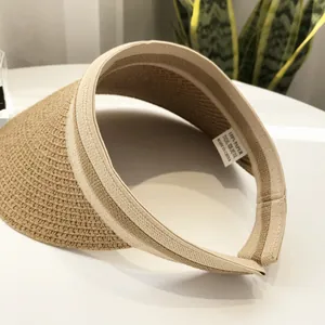 Beige straw open top sun hat for women with woven texture and 100% paper material label