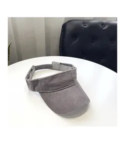 Detail view of dark grey sun visor featuring durable washed fabric and multi-line stitching