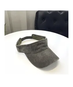 Detail of vintage washed cotton sun visor showing reinforced stitching on the brim