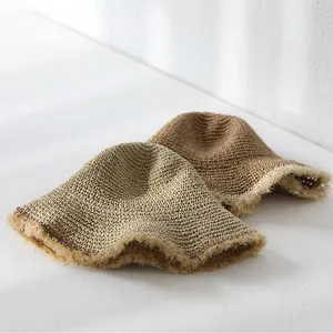 Handmade crochet straw bucket hats with fringe edges in khaki and brown colors