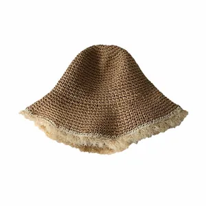 Handcrafted crochet straw sun hat for women with stylish fringed edges and wide brim