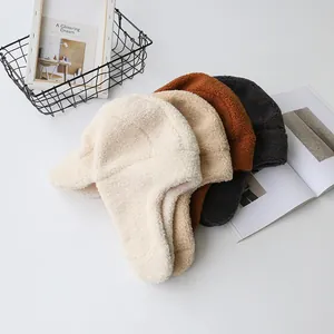 Plush lamb wool trapper hats with earflaps in four neutral colors for winter warmth