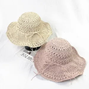 Handmade crochet summer straw sun hat with wavy brim and bow in cream and pink