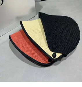 Detailed straw weave texture and ribbon edges on sun hats in black beige and orange colors