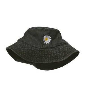 Classic black denim bucket hat featuring daisy embroidery for sun protection and street style
